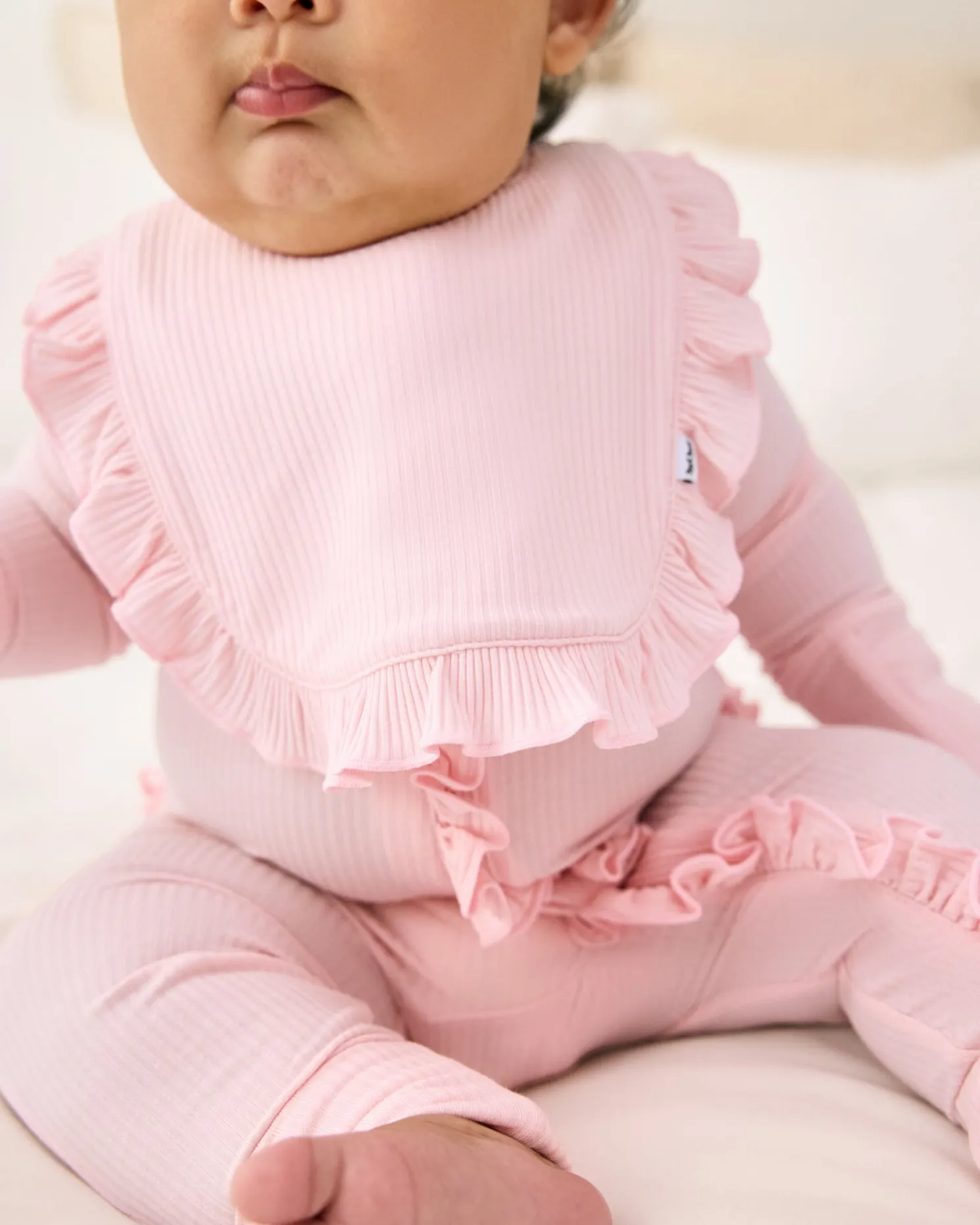 Prima Pink Ribbed Ruffle Bib